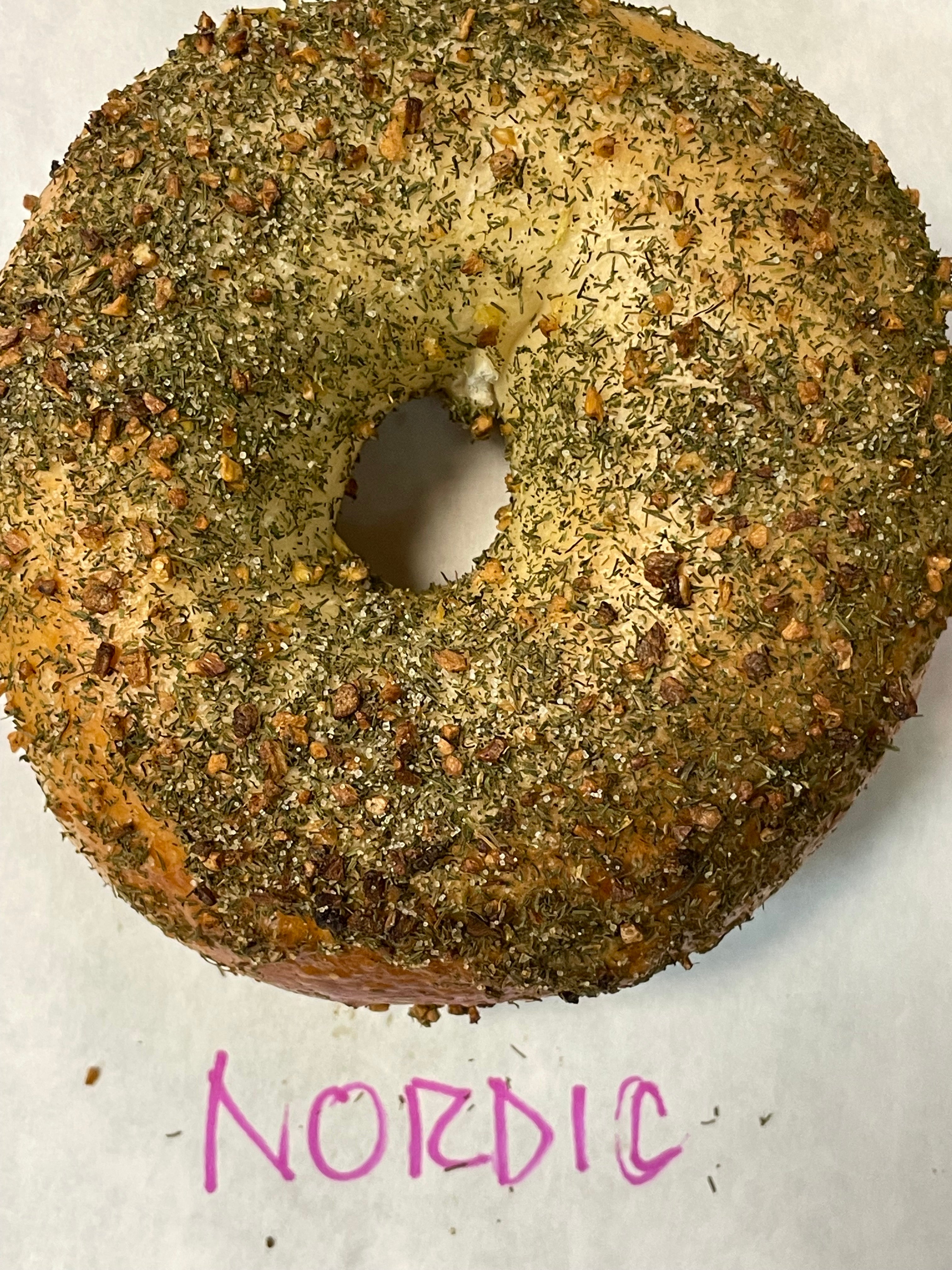 Freshly baked Nordic bagel with dill, garlic, onion and salt